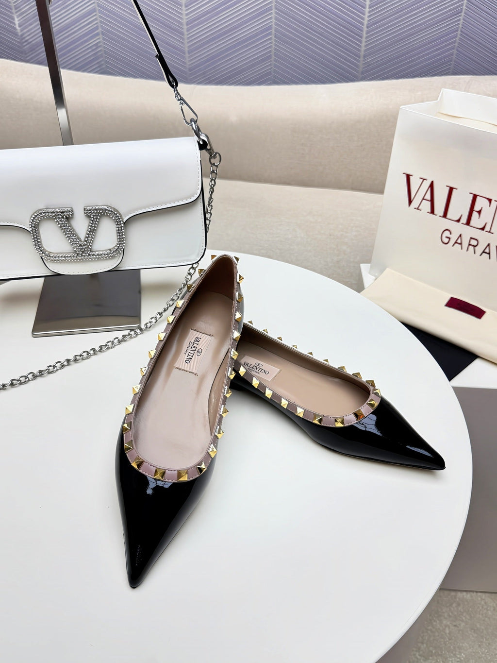 ROCKSTUD FLAT PUMP IN BLACK CALFSKIN