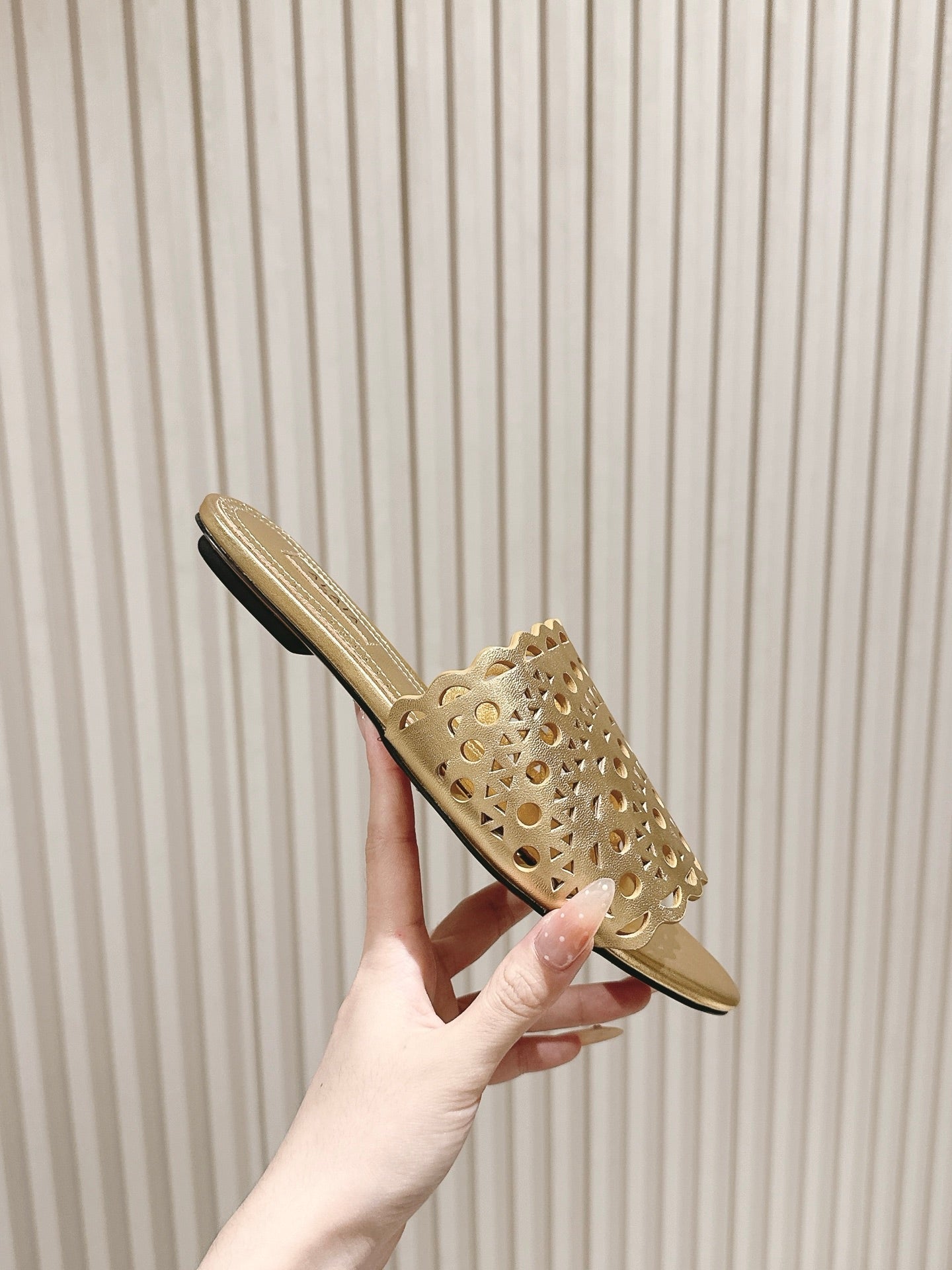 ALAIA PERFORATED SLIDE SANDALS 25S IN LIGHT GOLD LAMBSKIN