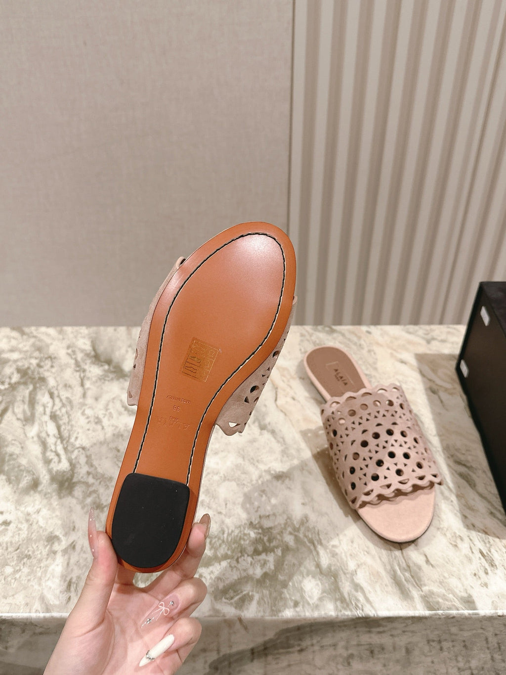 ALAIA PERFORATED SLIDE SANDALS 25S IN PINK BEIGE SUEDE