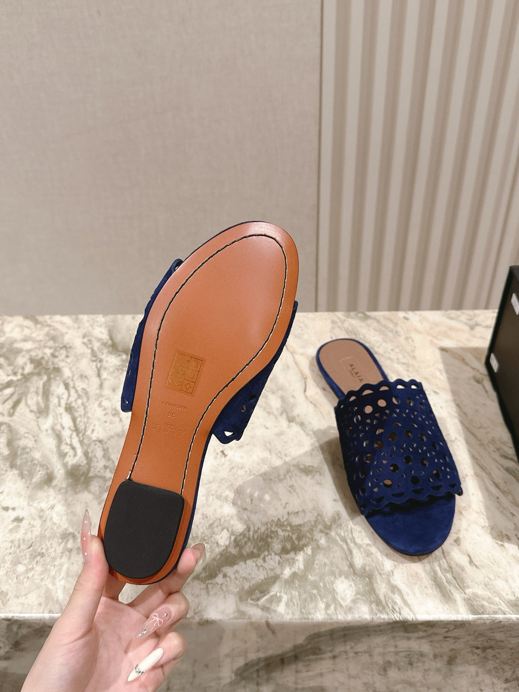 ALAIA PERFORATED SLIDE SANDALS 25S IN NAVY BLUE SUEDE