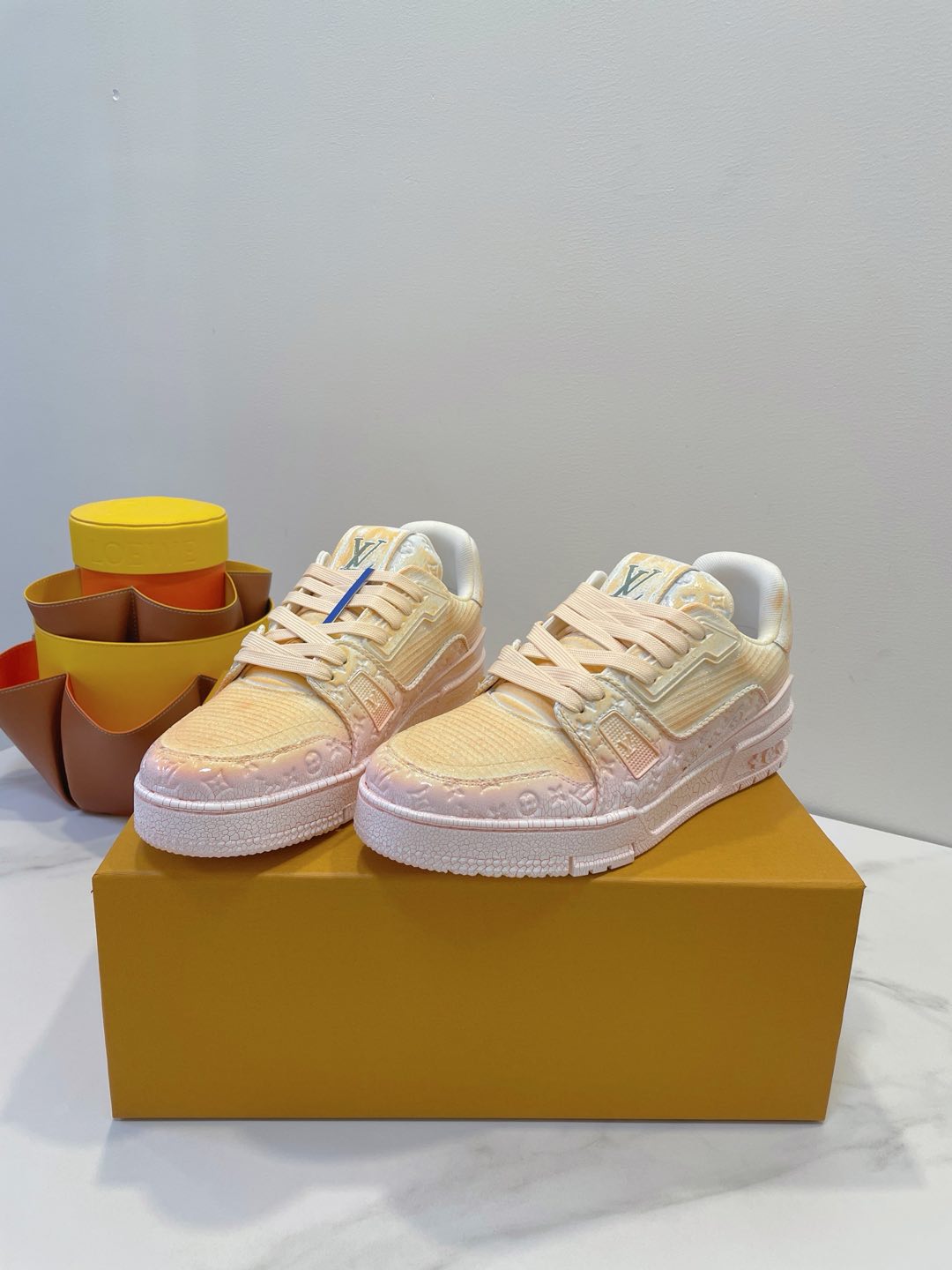LV TRAINER MAXI SNEAKER IN LIGHT PINK OMBRE ORANGE EMBOSSED CALFSKIN