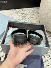 PRADA 25S RUBBER SLIDE IN CHARCOAL CALFSKIN WITH LOGO