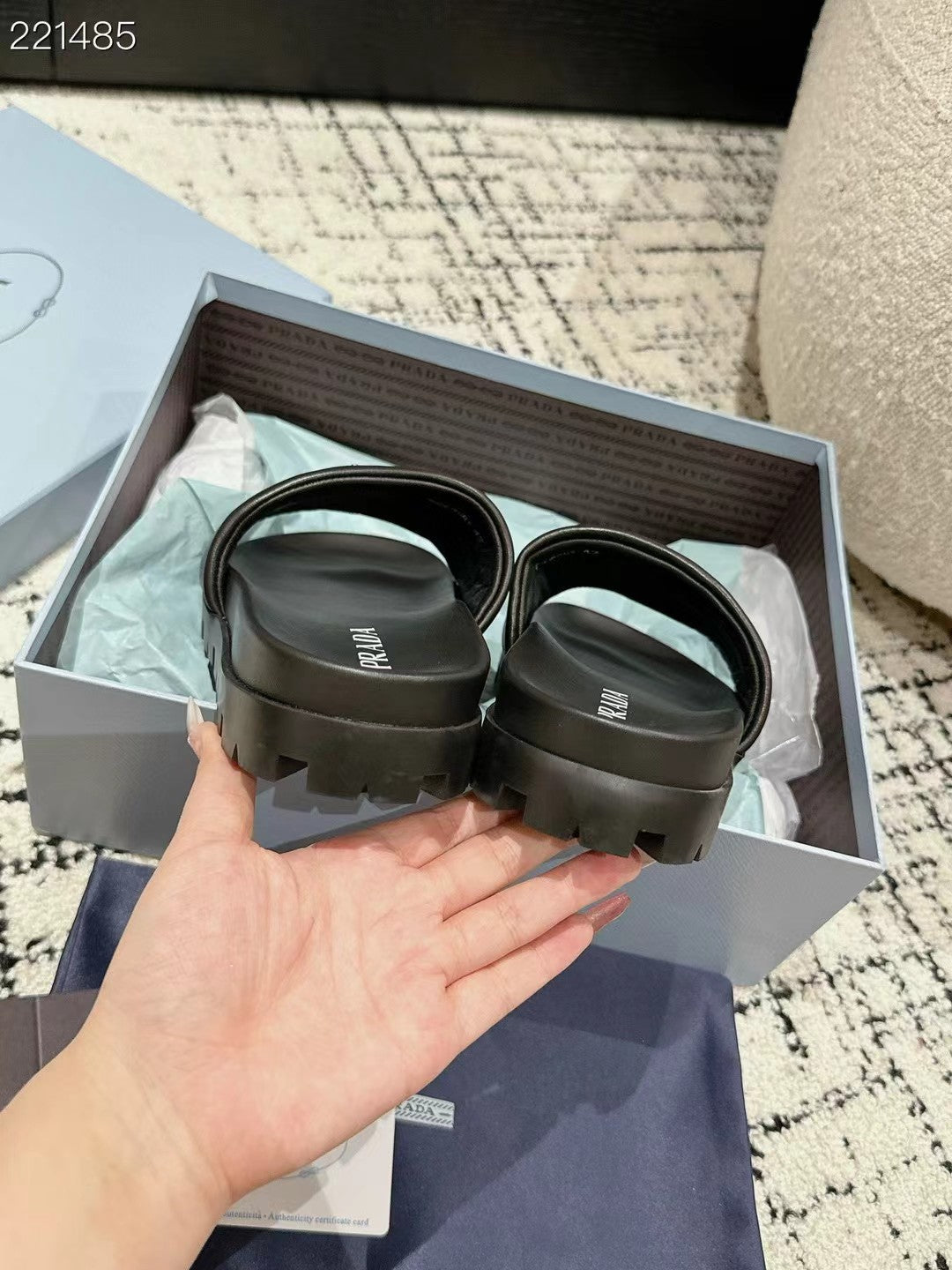 PRADA 25S PADDED SLIDES IN BLACK CALFSKIN WITH LOGO