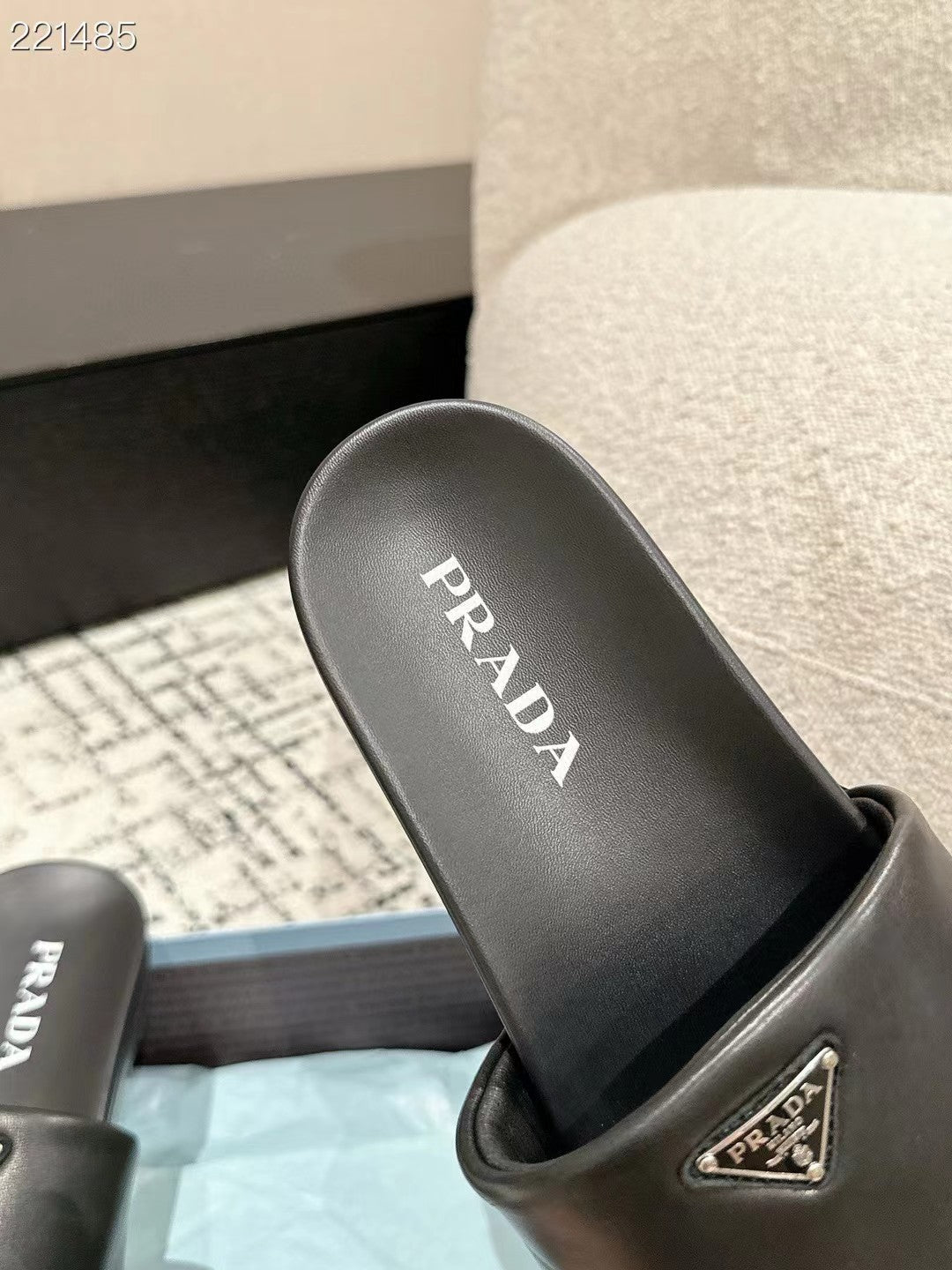 PRADA 25S PADDED SLIDES IN BLACK CALFSKIN WITH LOGO