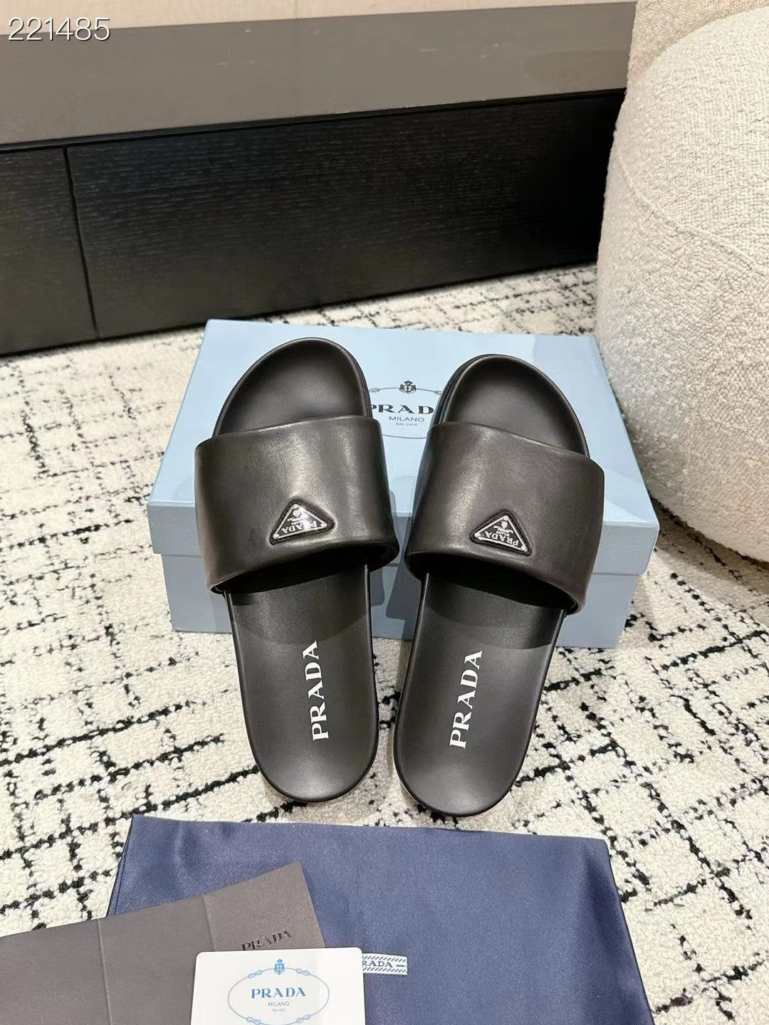PRADA 25S PADDED SLIDES IN BLACK CALFSKIN WITH LOGO