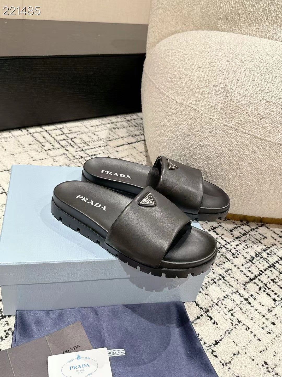 PRADA 25S PADDED SLIDES IN BLACK CALFSKIN WITH LOGO
