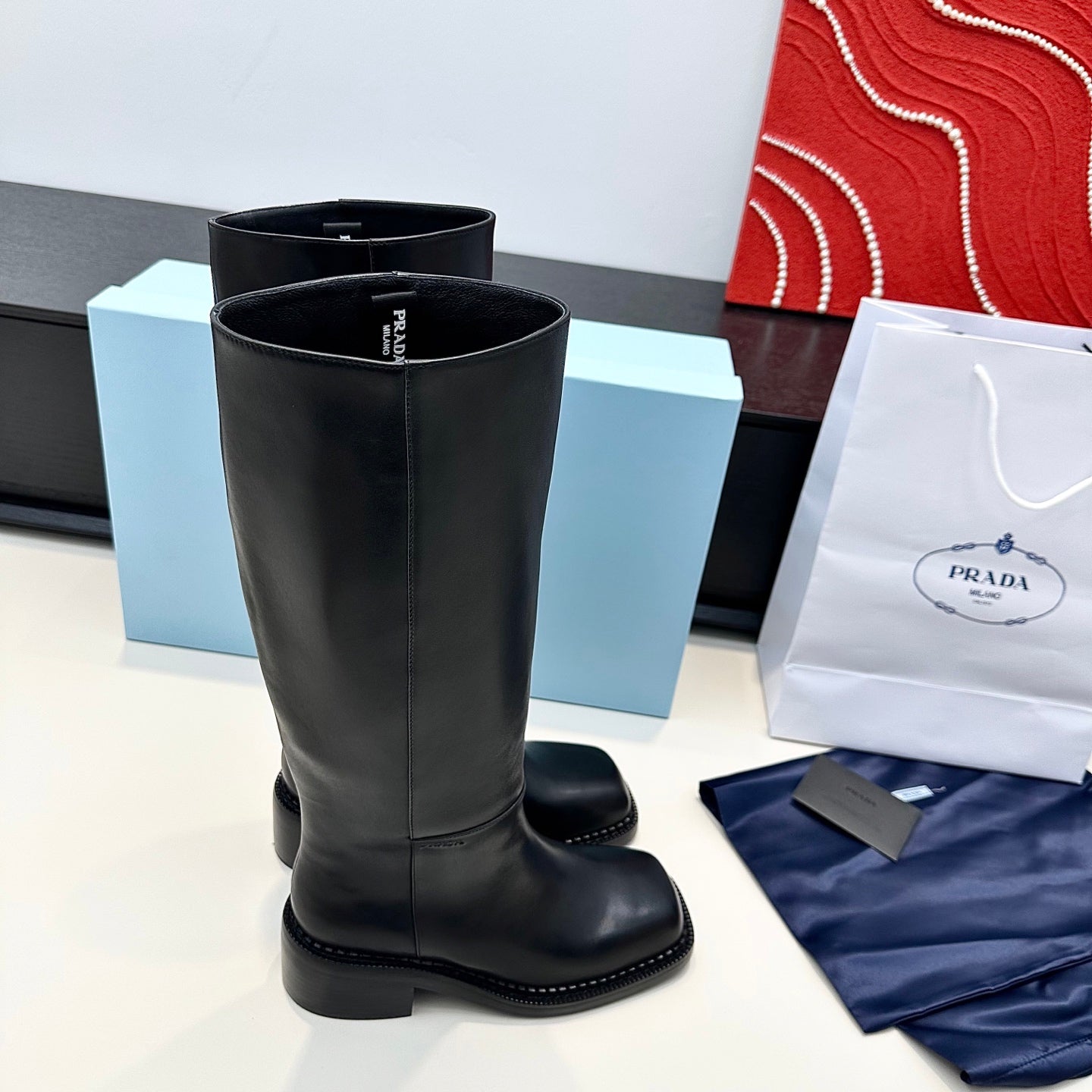 PRADA 25S SQUARE-TOE HIGH-CUT BOOTS IN BLACK CALFSKIN