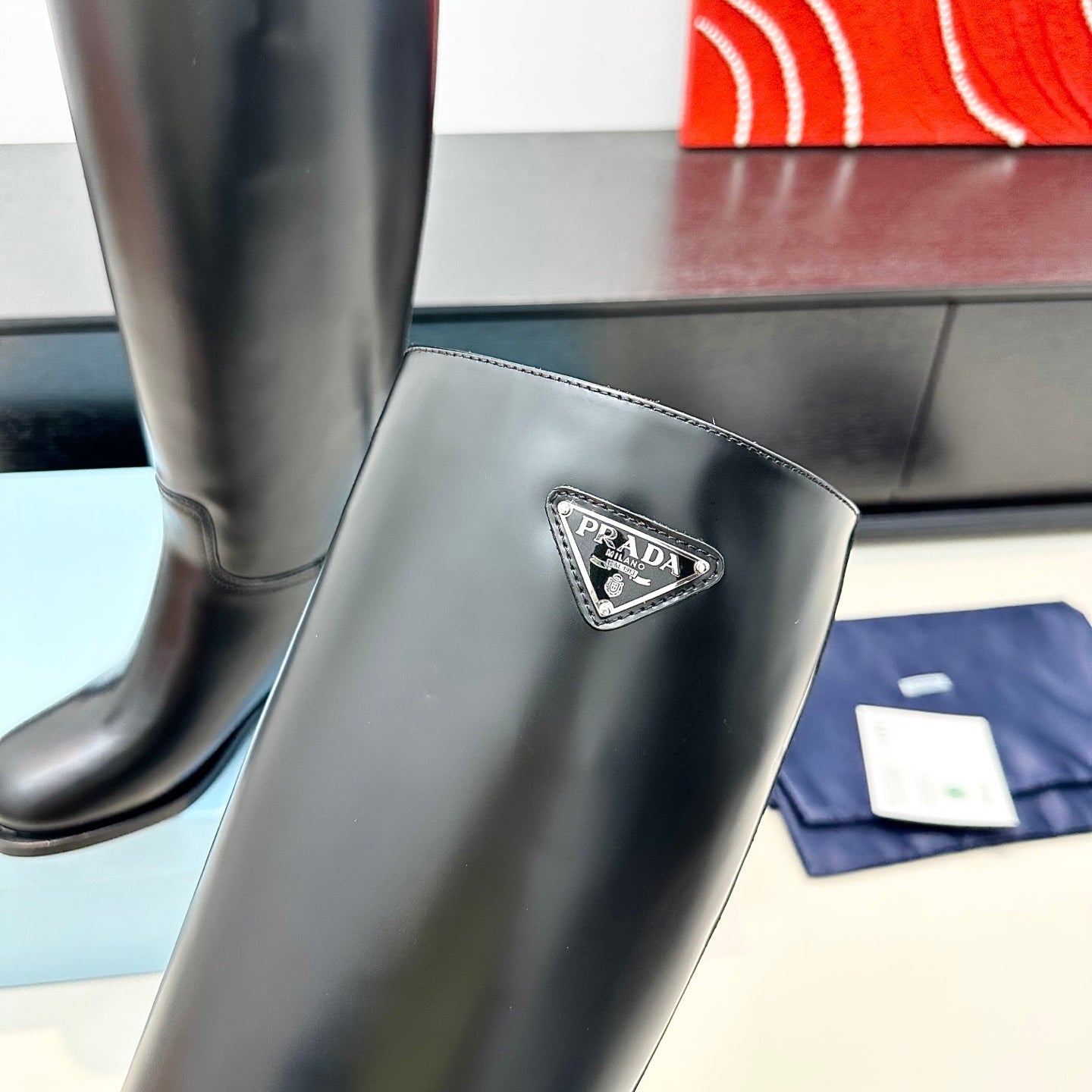 PRADA 25S HIGH-CUT BOOTS 55 MM IN BLACK CALFSKIN