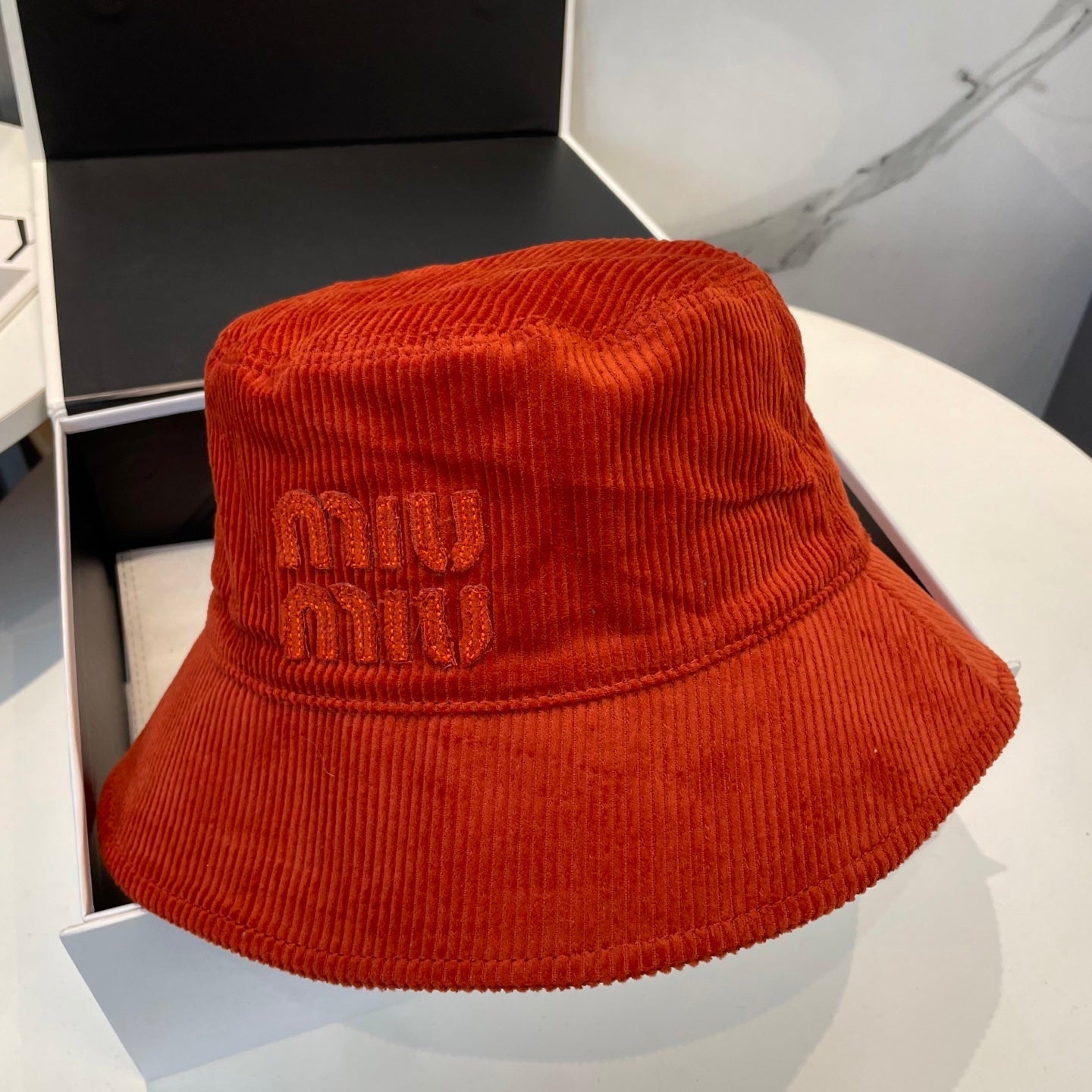 MM BUCKET IN ORANGE VELVET WITH LOGO