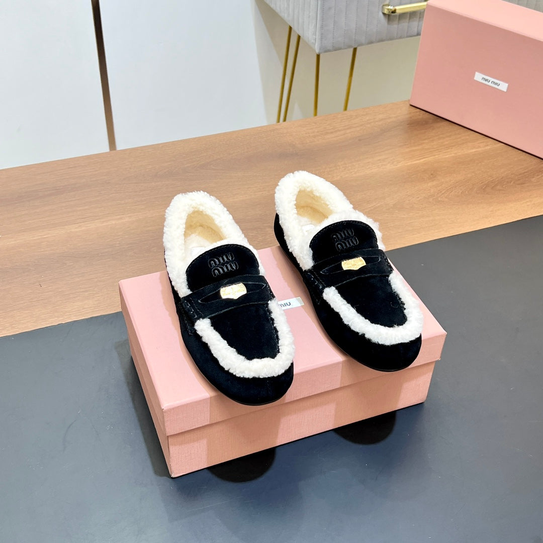 LOAFERS IN BLACK SUEDE AND WHITE SHEARLING TRIM