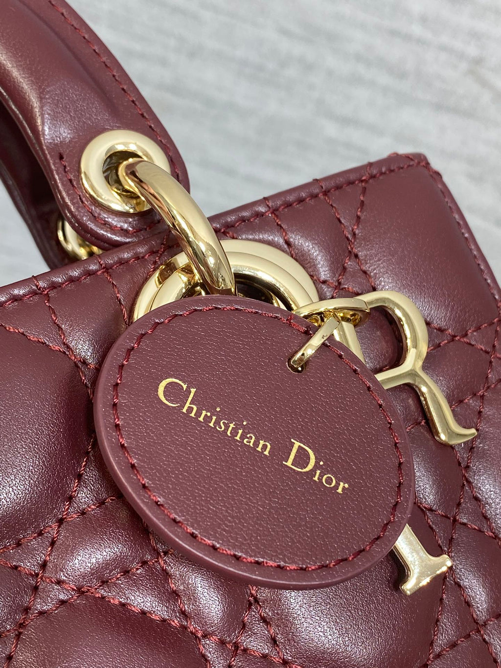 DIOR 25S SMALL LADY D‑JOY BAG 19 IN BURGUNDY CANNAGE CALFSKIN GOLD HARDWARE