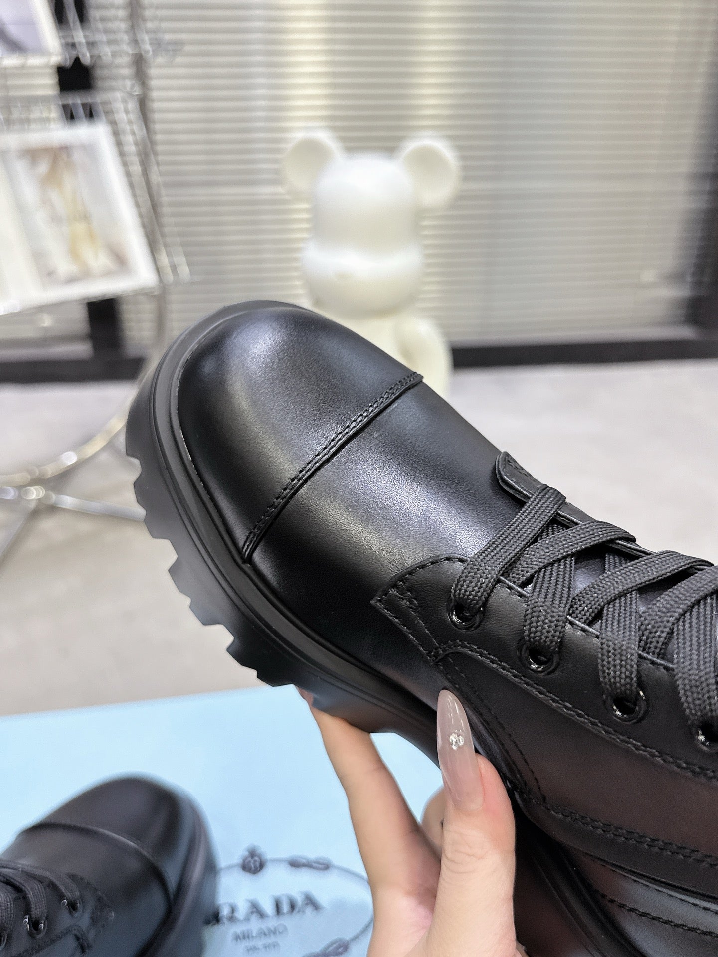 PRADA 25S WARRIOR BOOTS IN BLACK CALFSKIN