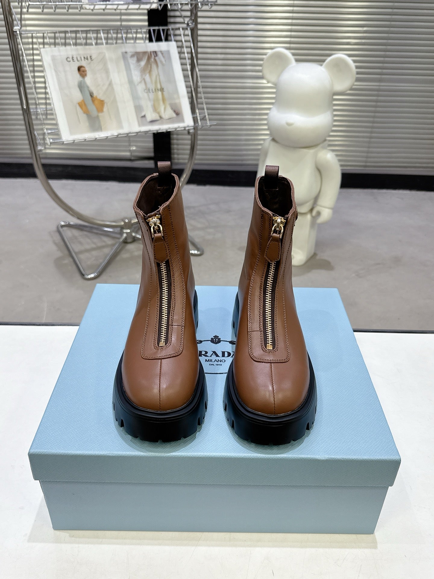 PRADA 25S ZIP-UP ANKLE BOOTS IN BROWN CALFSKIN