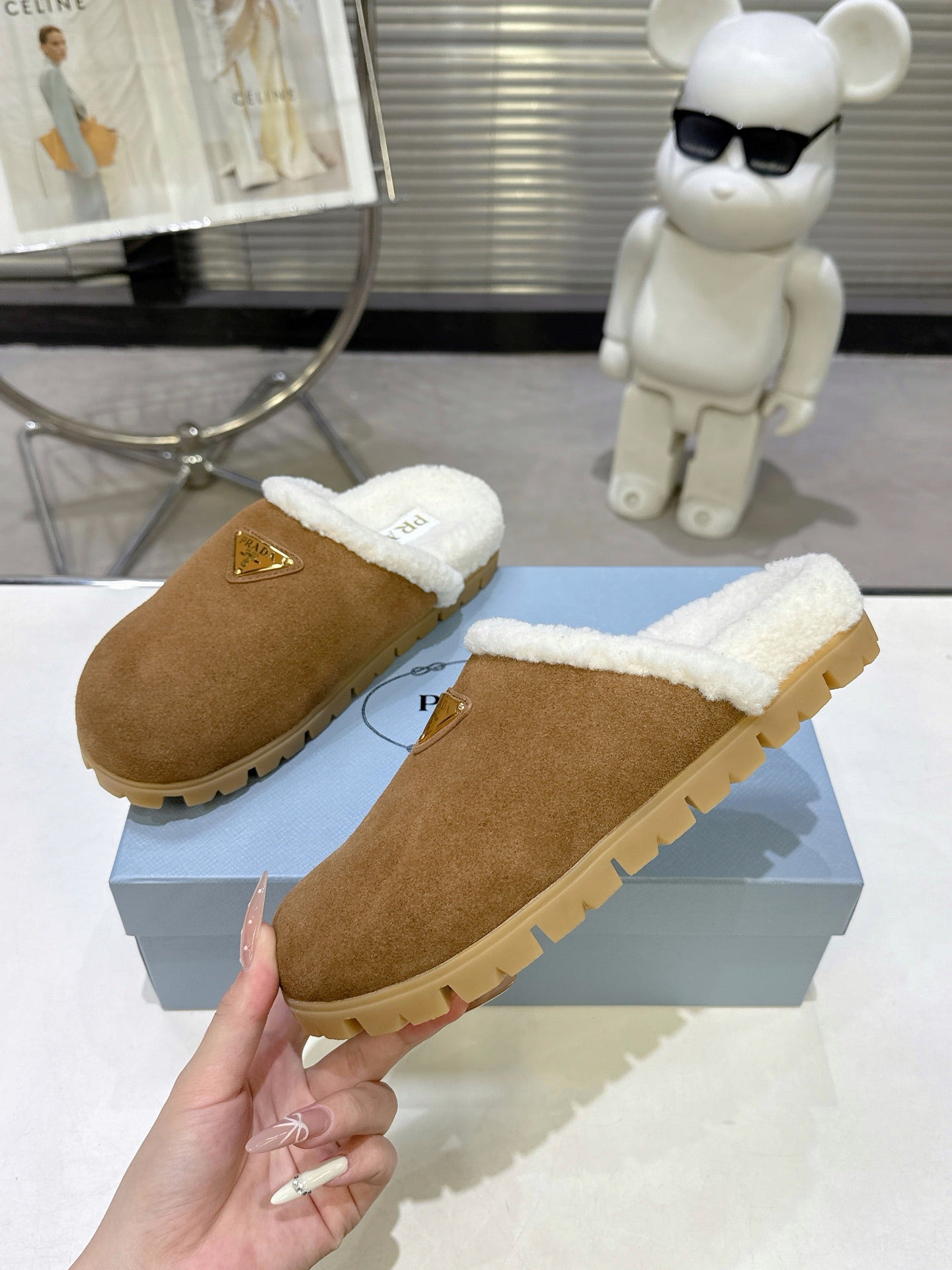 PRADA 25S FUR-LINED MULES IN BROWN SUEDE