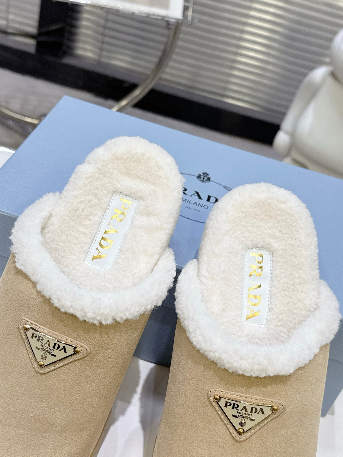 PRADA 25S FUR-LINED MULES IN BEIGE SUEDE