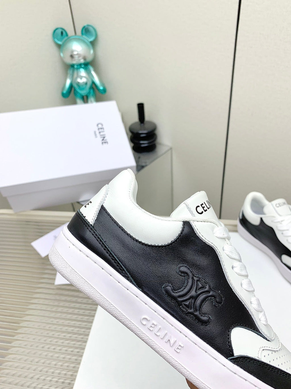 SNEAKER WITH TRIOMPHE IN BLACK AND WHITE CALFSKIN