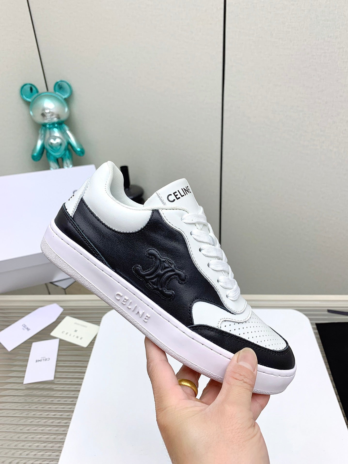 SNEAKER WITH TRIOMPHE IN BLACK AND WHITE CALFSKIN