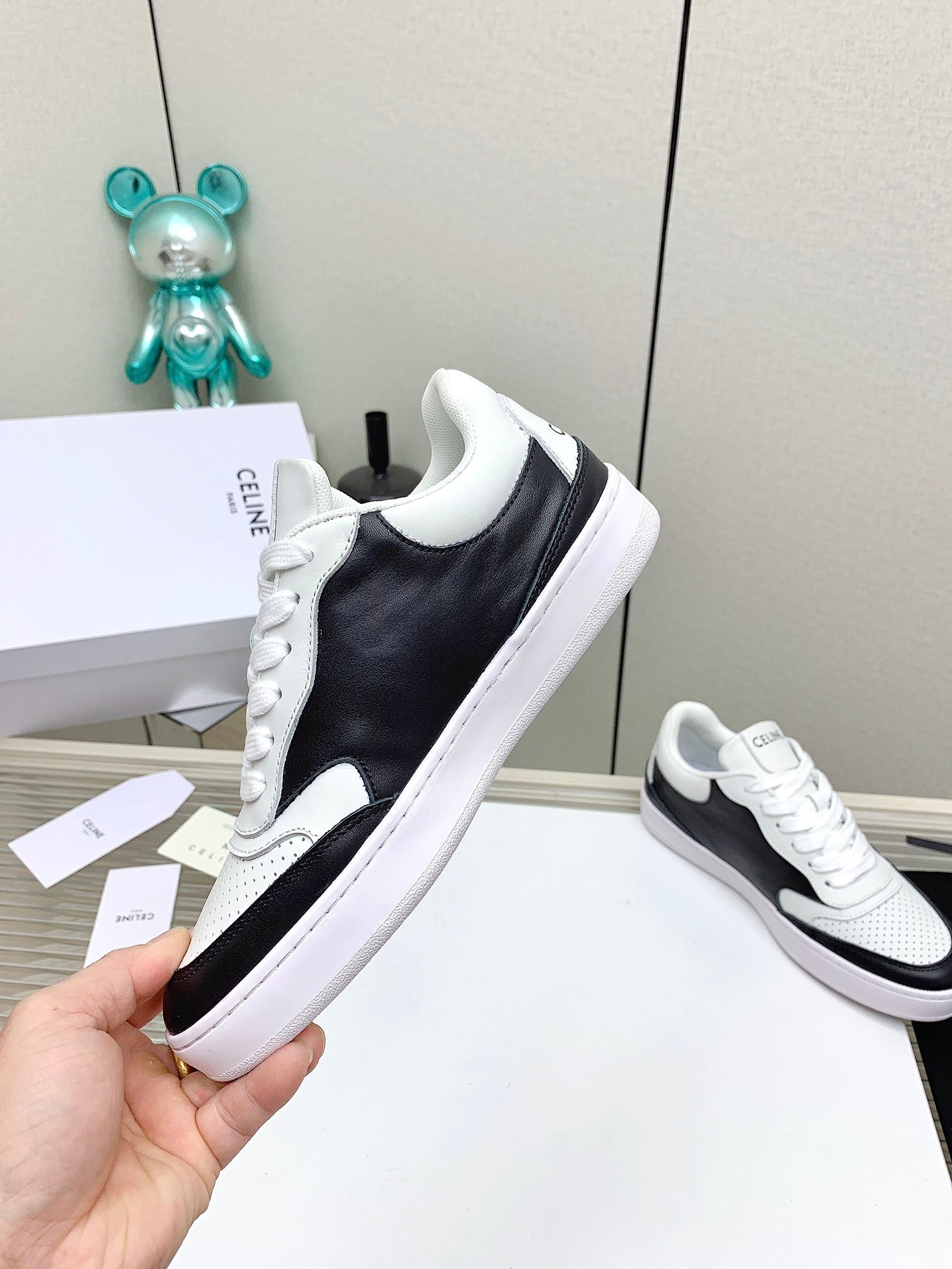 SNEAKER WITH TRIOMPHE IN BLACK AND WHITE CALFSKIN
