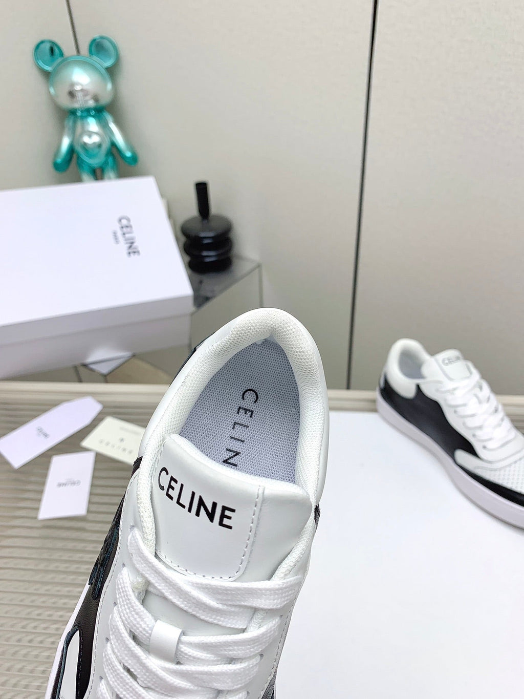 SNEAKER WITH TRIOMPHE IN BLACK AND WHITE CALFSKIN