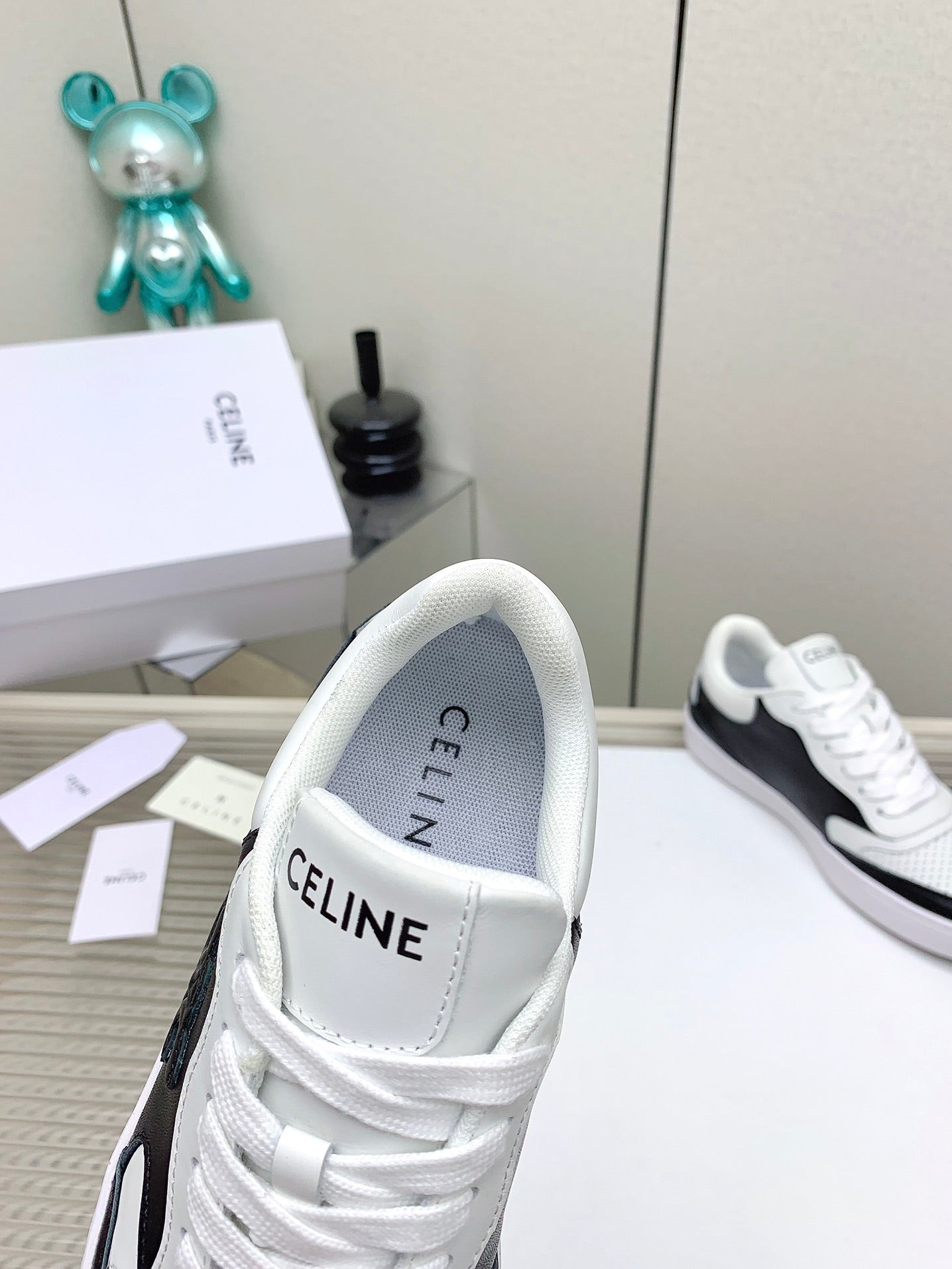 SNEAKER WITH TRIOMPHE IN BLACK AND WHITE CALFSKIN