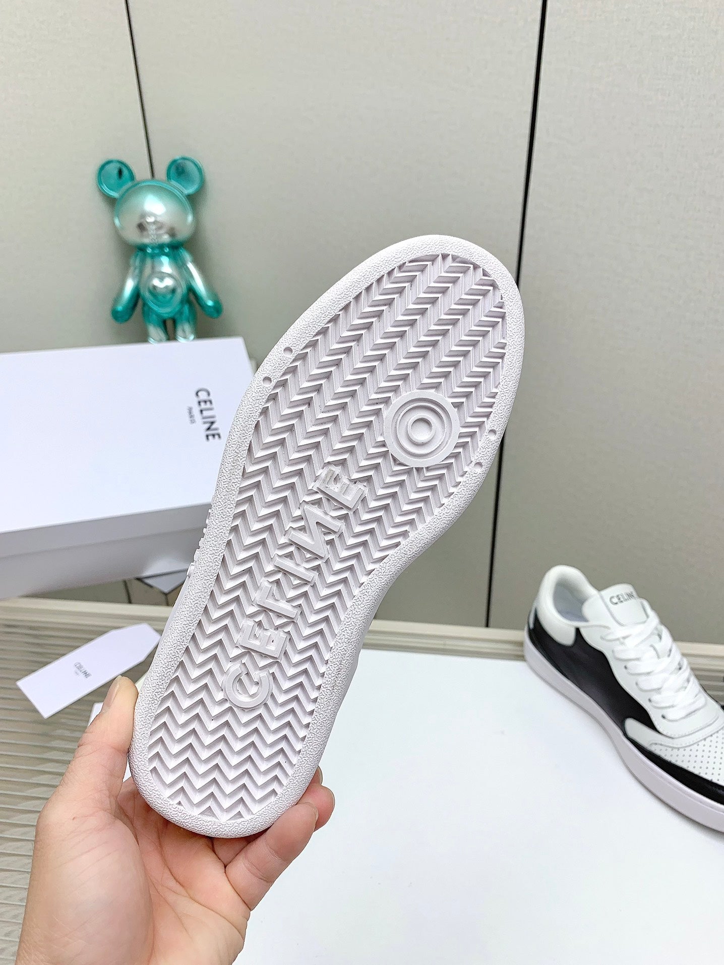 SNEAKER WITH TRIOMPHE IN BLACK AND WHITE CALFSKIN