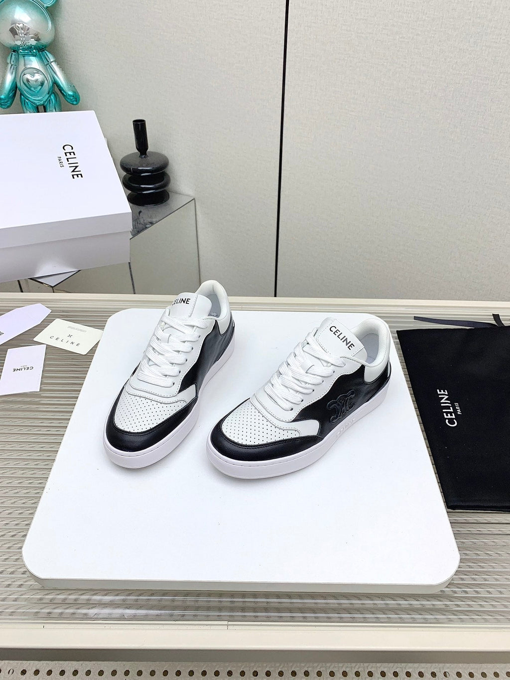 SNEAKER WITH TRIOMPHE IN BLACK AND WHITE CALFSKIN