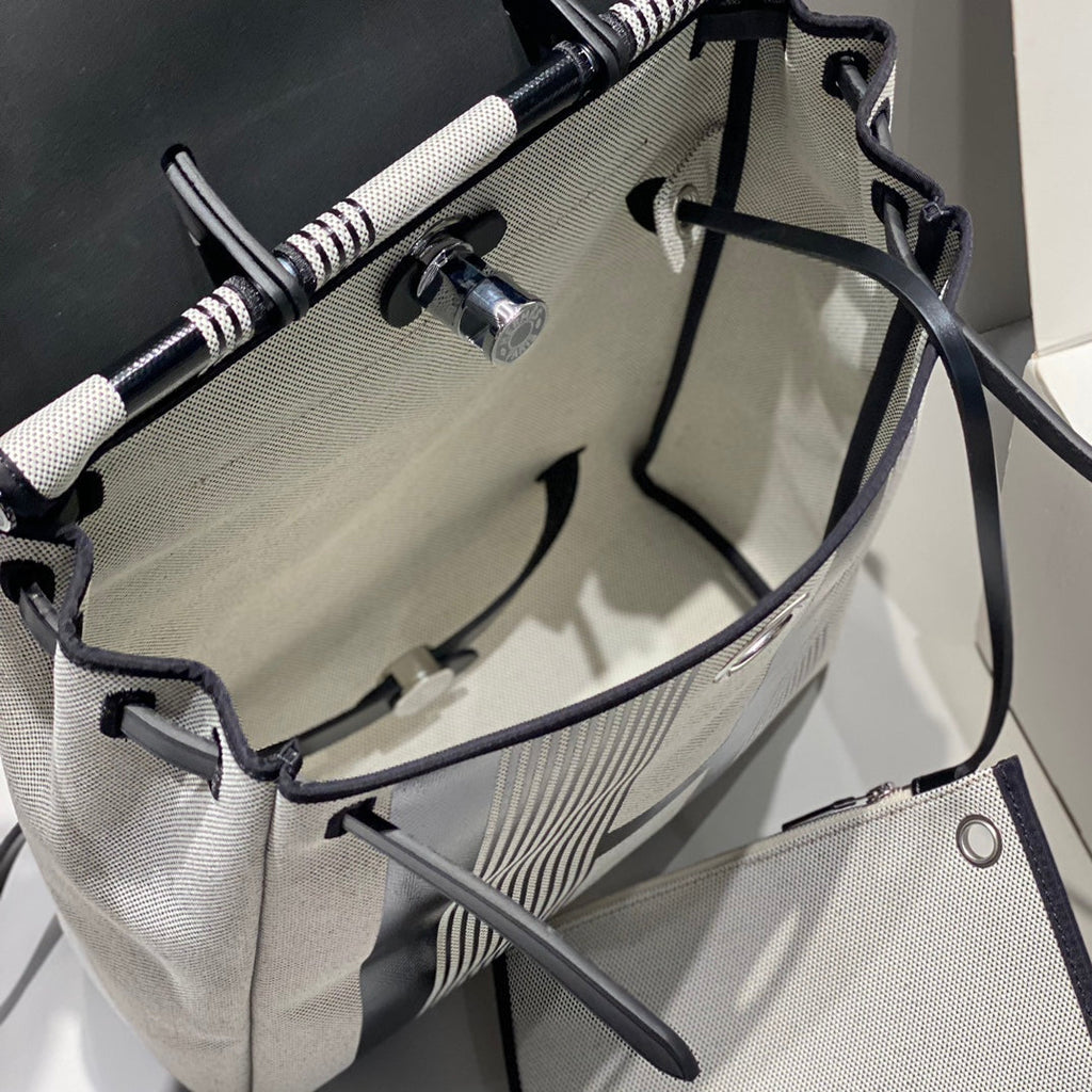 HERBAG A DOS ZIP RETOURNE BACKPACK 29 IN OFF-WHITE MIX BLACK CANVAS AND CALFSKIN