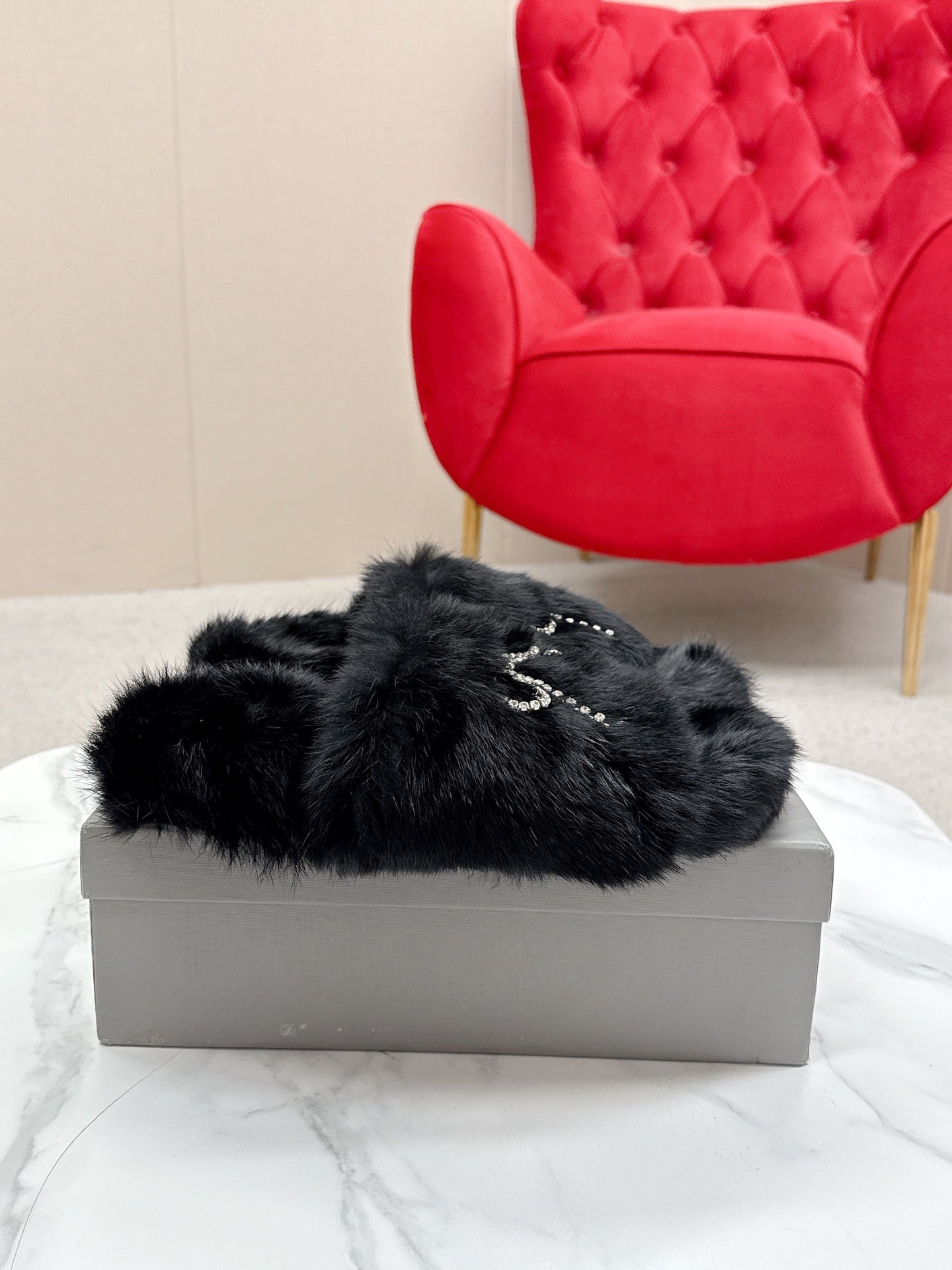 BALENCIAGA 25S SOFT FUR SLIPPERS IN BLACK FUR WITH RHINESTONE BOW
