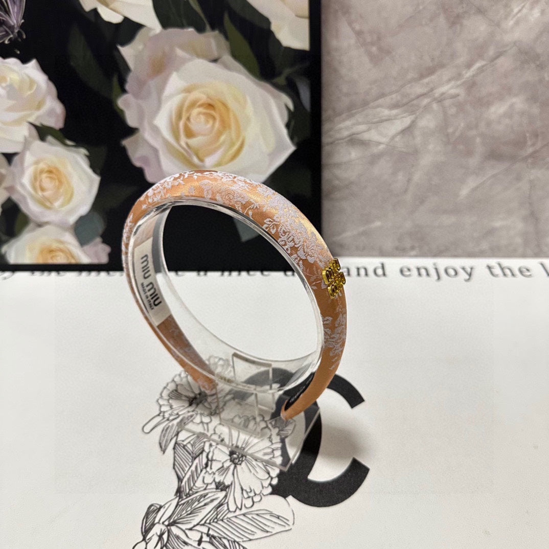 HEADBAND WITH GARNITURE PRINT IN TIGER EYE ORANGE SILK 432822