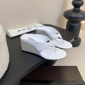 ALAIA WEDGE THONG SANDALS 25S IN WHITE SATIN