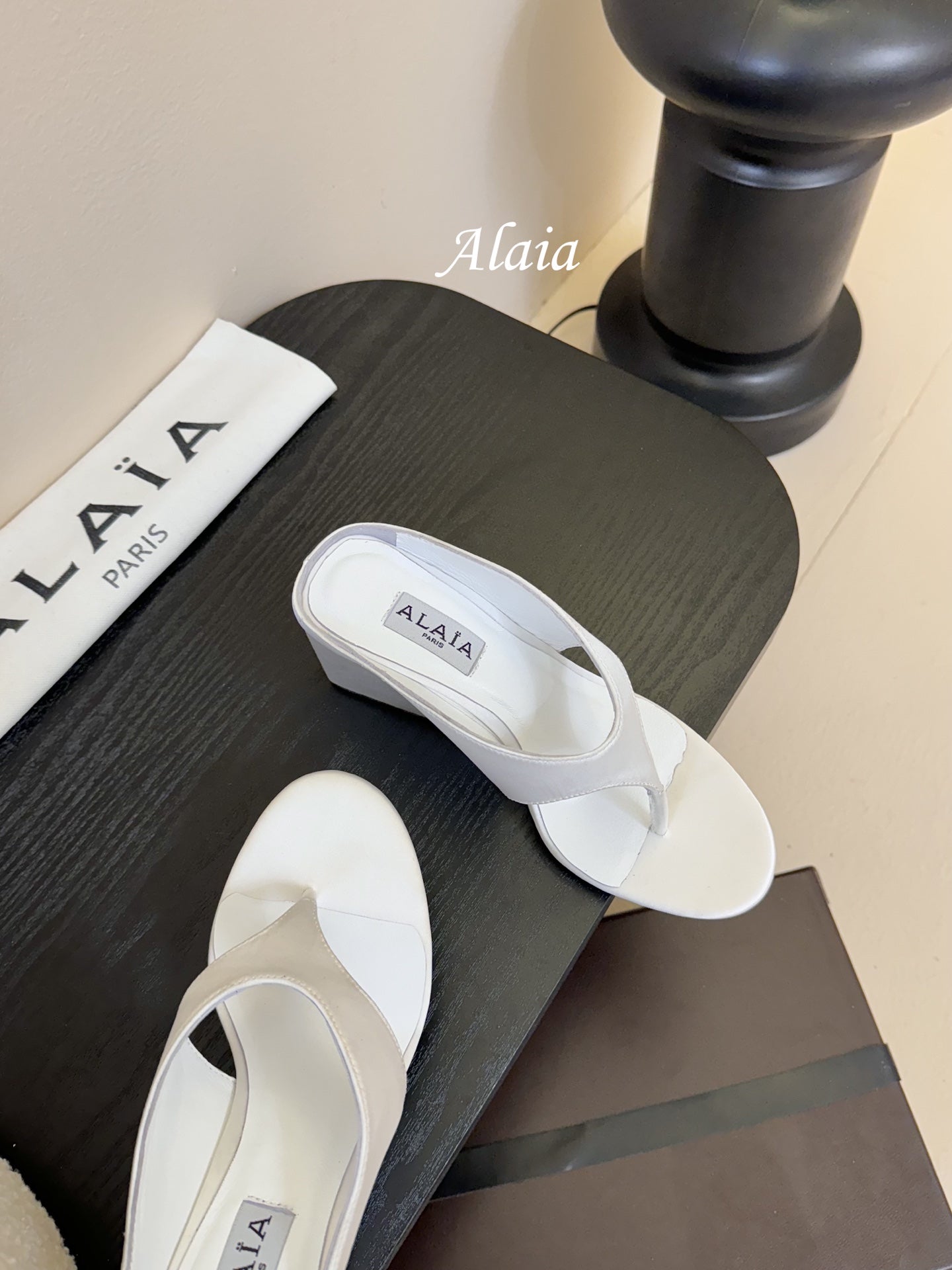 ALAIA WEDGE THONG SANDALS 25S IN WHITE SATIN