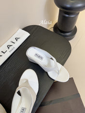 ALAIA WEDGE THONG SANDALS 25S IN WHITE SATIN