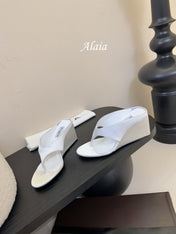 ALAIA WEDGE THONG SANDALS 25S IN WHITE SATIN