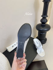ALAIA WEDGE THONG SANDALS 25S IN WHITE SATIN