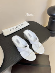 ALAIA WEDGE THONG SANDALS 25S IN WHITE SATIN