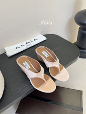 ALAIA WEDGE THONG SANDALS 25S IN BLUSH BEIGE SATIN