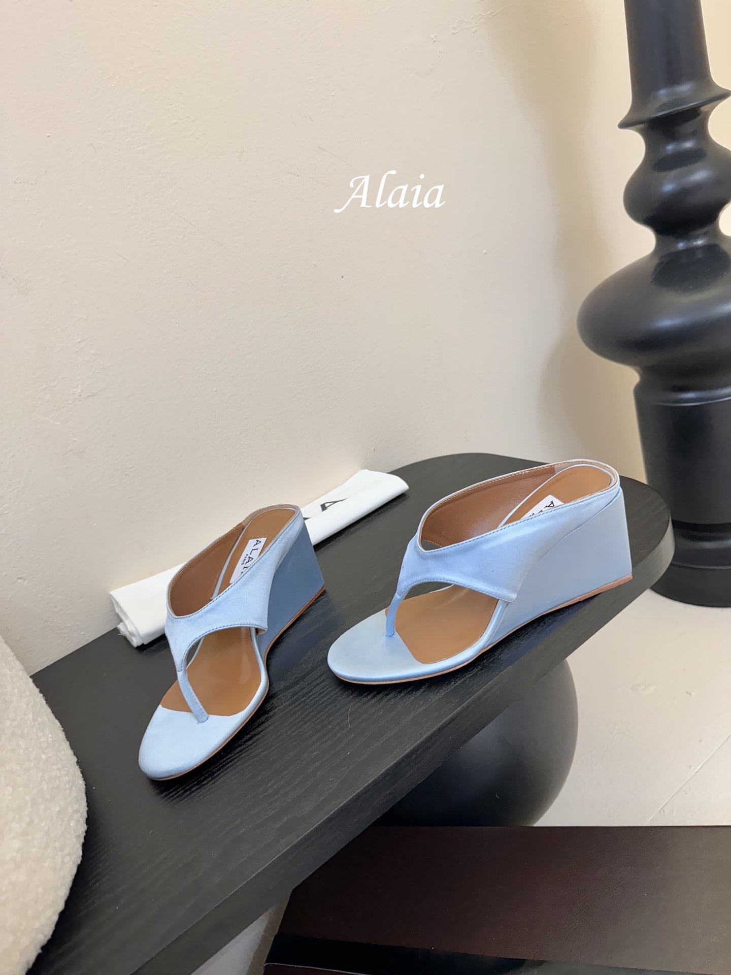 ALAIA WEDGE THONG SANDALS 25S IN BLUE SATIN