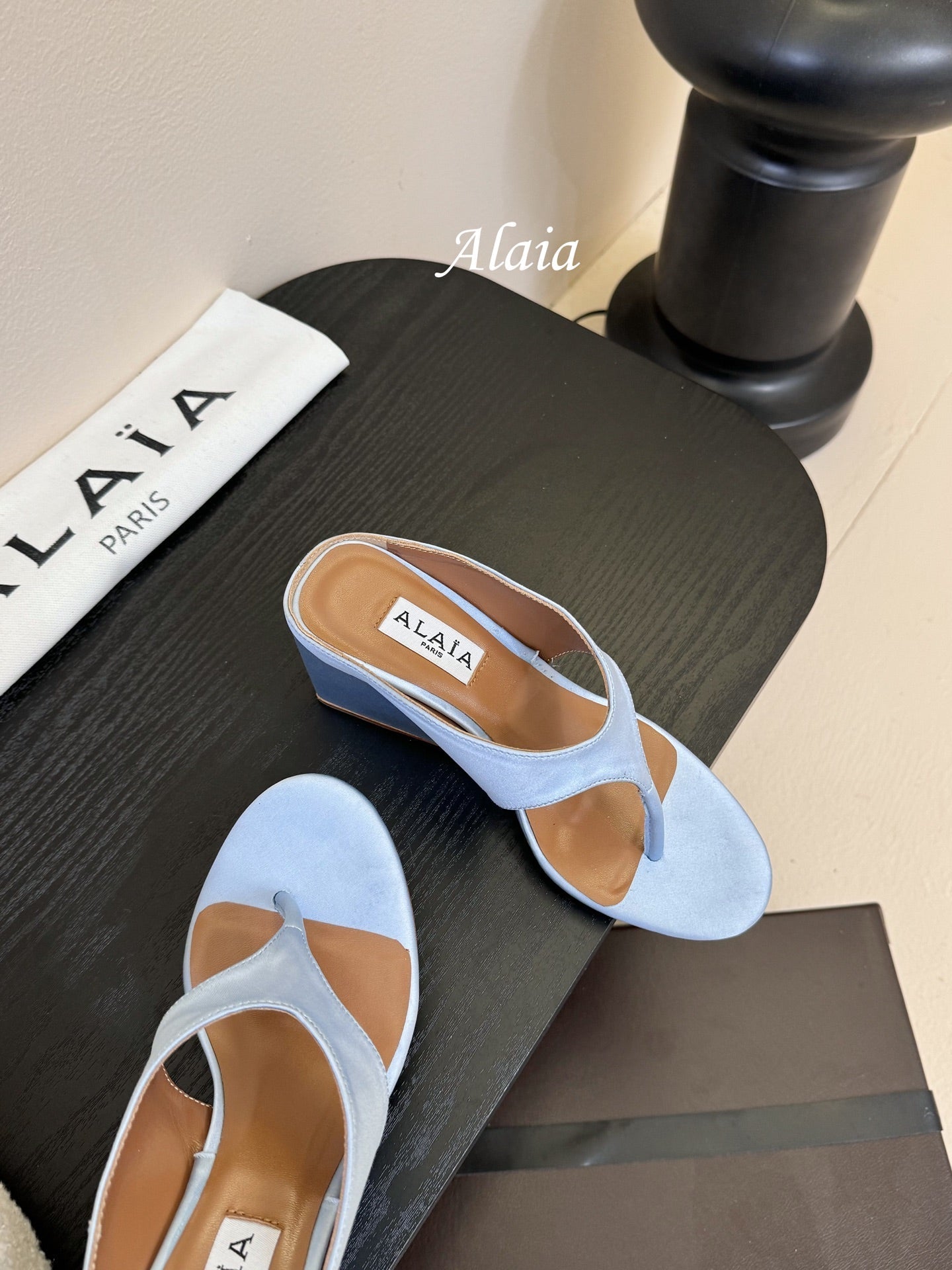 ALAIA WEDGE THONG SANDALS 25S IN BLUE SATIN