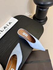 ALAIA HIGH MULES 25S IN LIGHT BLUE SATIN