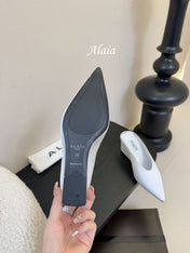 ALAIA HIGH MULES 25S IN WHITE SATIN