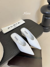 ALAIA HIGH MULES 25S IN WHITE SATIN