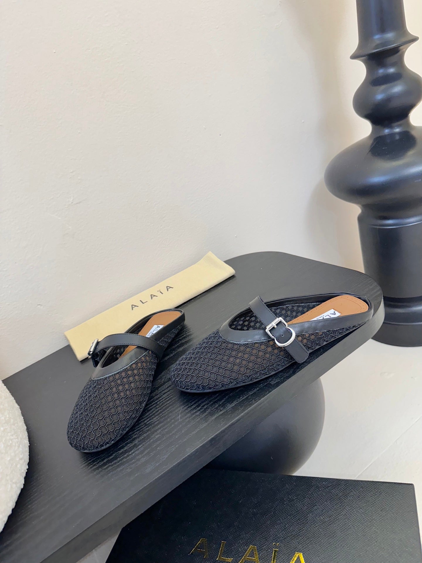 ALAIA FLAT MULES 25S IN BLACK WOVEN MESH