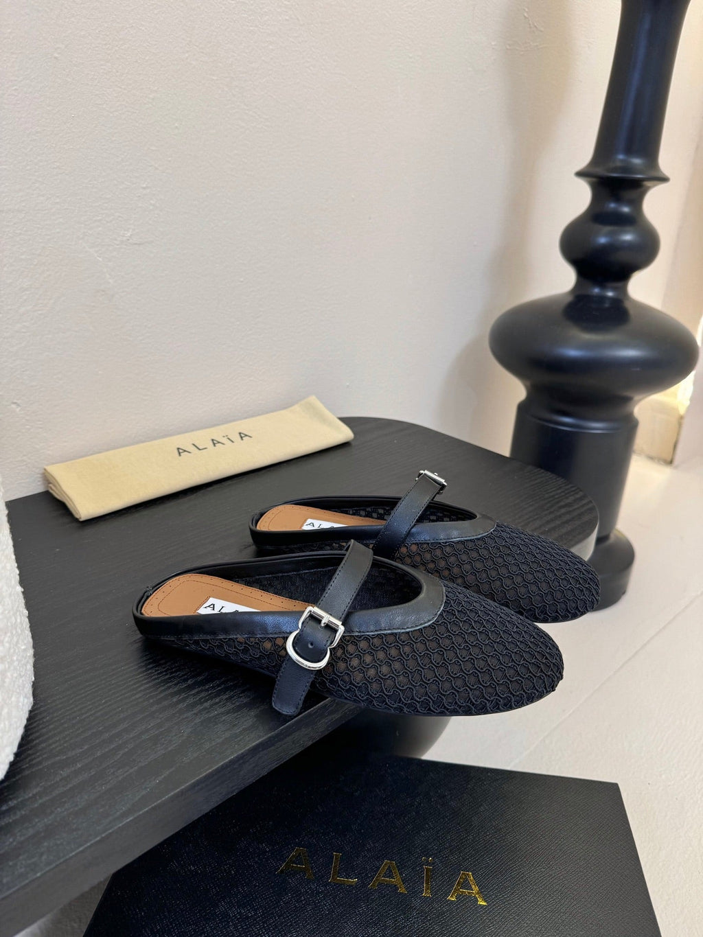 ALAIA FLAT MULES 25S IN BLACK WOVEN MESH