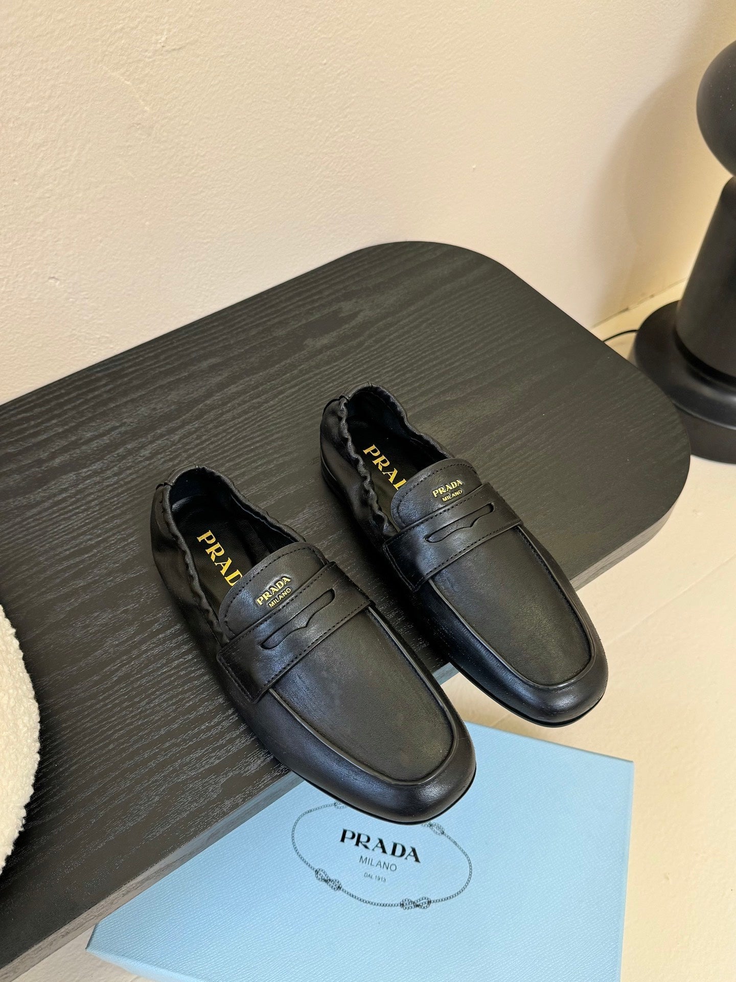 PRADA 25S SHUFFLE LOAFERS IN BLACK CALFSKIN