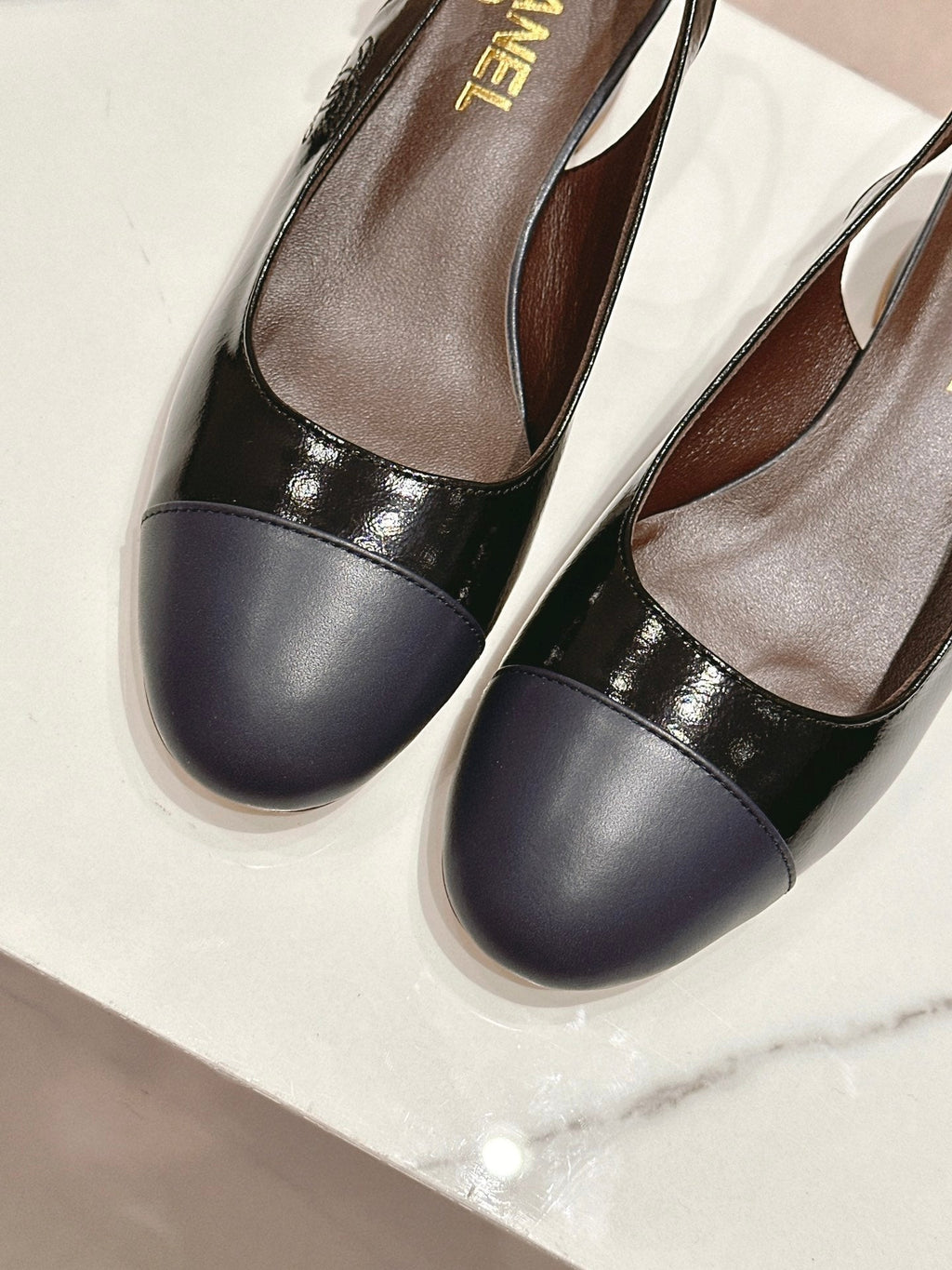 SLINGBACKS IN BLACK SHEEPSKIN