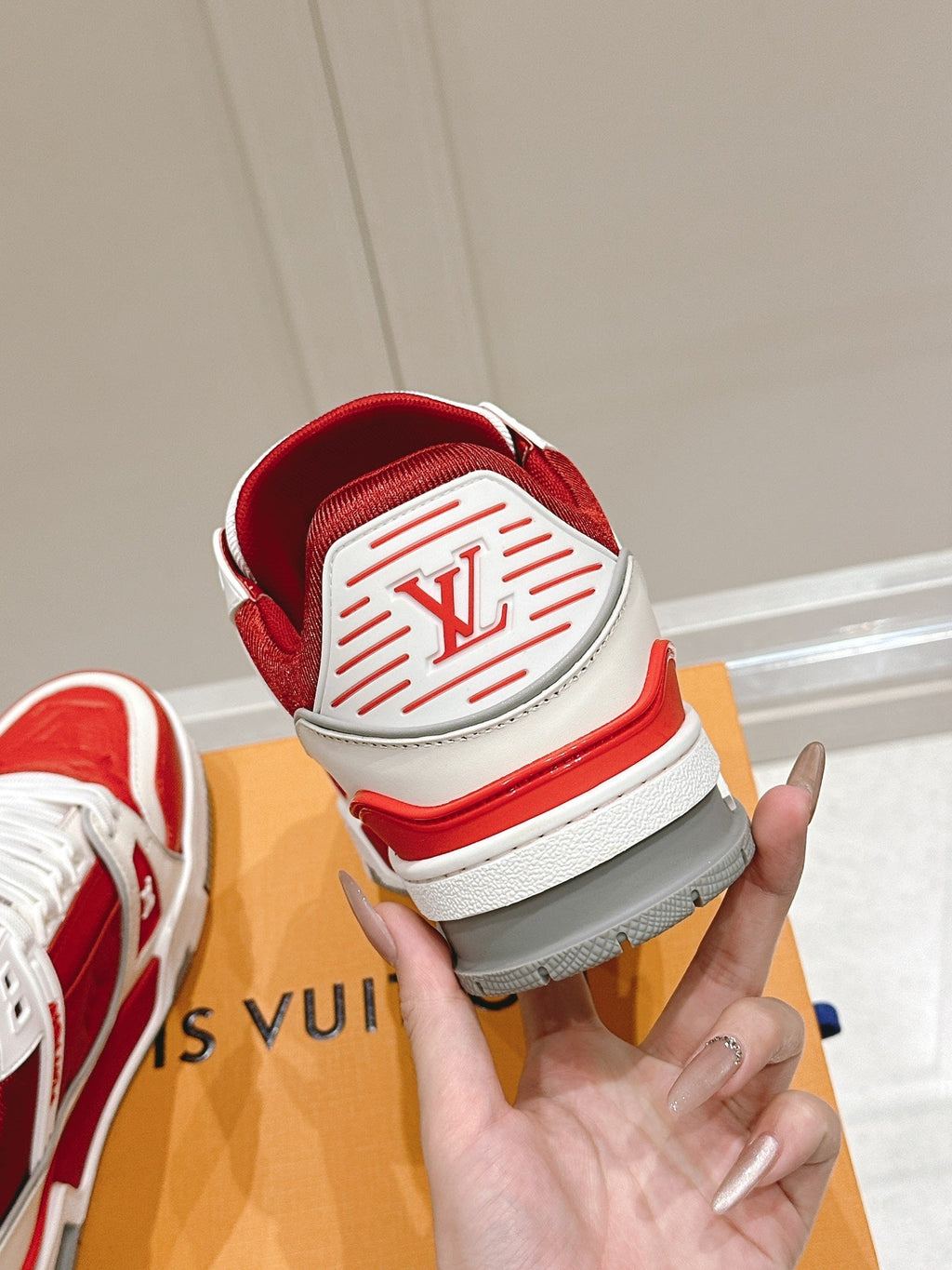 LV TRAINER SNEAKER IN SARI RED GRAINED CALFSKIN