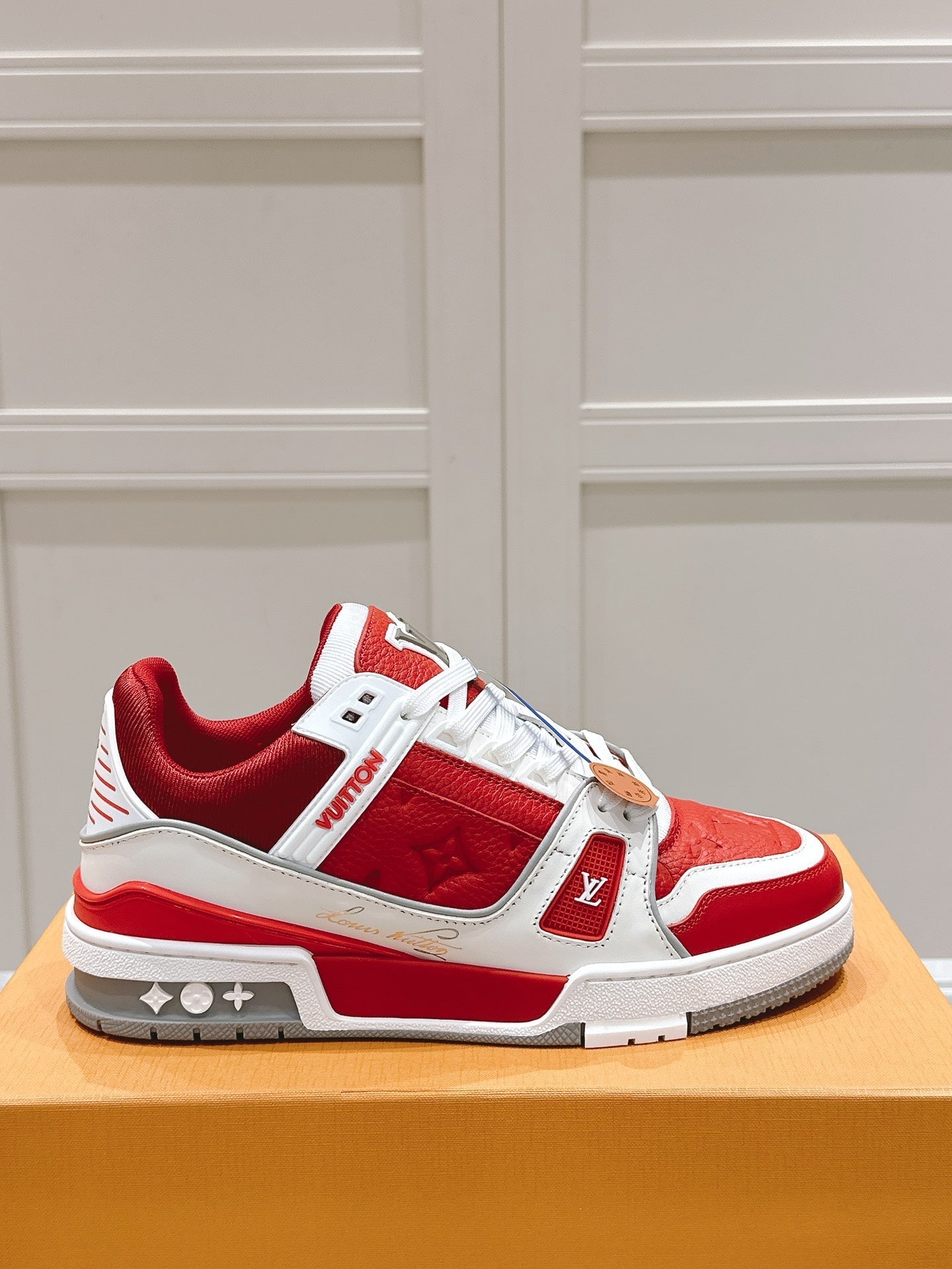 LV TRAINER SNEAKER IN SARI RED GRAINED CALFSKIN