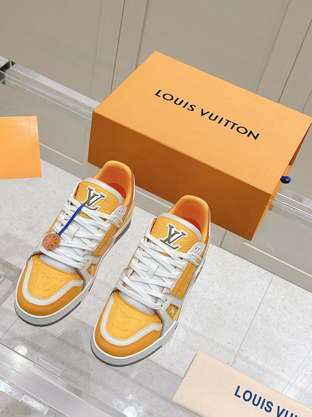 LV TRAINER SNEAKER IN SAFFRAN YELLOW GRAINED CALFSKIN