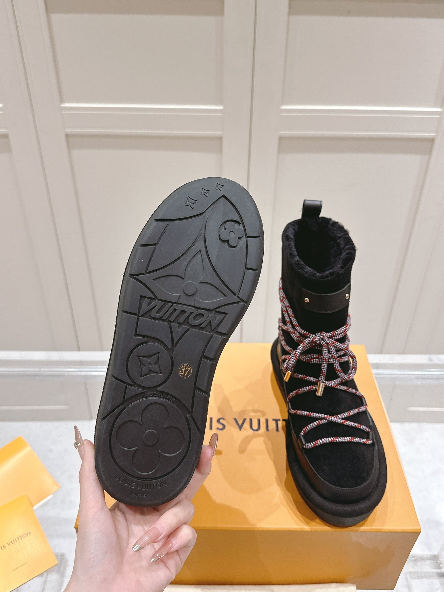 ASPEN PLATFORM ANKLE BOOT IN BLACK MONOGRAM DEBOSSED SUEDE AND SHEARLING