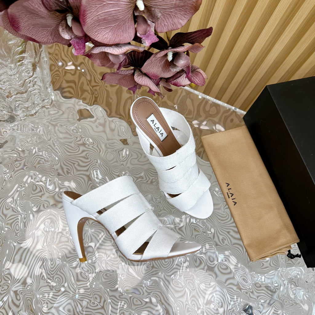 ALAIA ELASTIC CAGE MULE SANDALS IN WHITE WOVEN STRAP AND LAMBSKIN